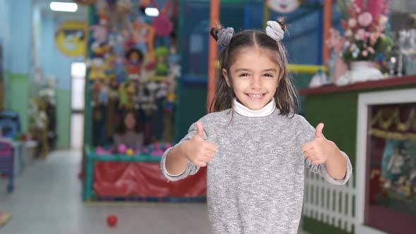 5-year-old girl smiling in children's playground