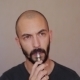 Guy With a Beard Smokes Electronic Cigarette - VideoHive Item for Sale