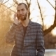 Guy With Beard Speaks On The Phone Outdoor - VideoHive Item for Sale