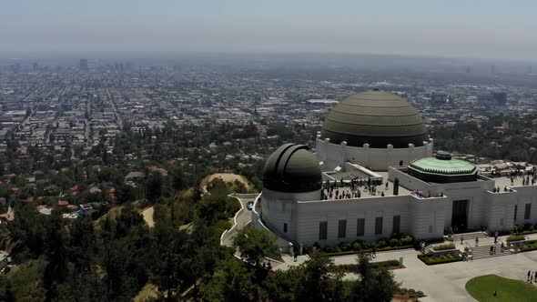 Aerial shoting past Griffith observatory to reveal downtown Los Angeles