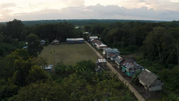 Flying over a Village in Amazonia in Peru, sunset on Amazon River 4K