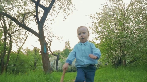 Little Boy Running Along The Park Alley alt