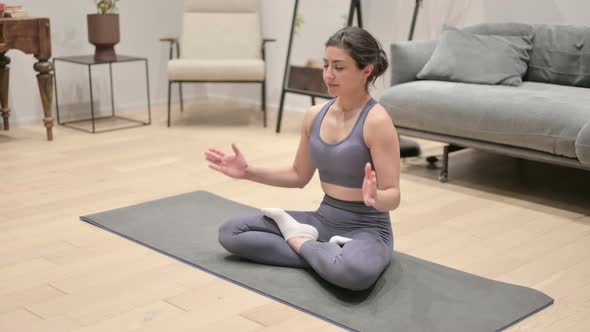 Young Indian Woman Doing Meditation on Yoga Mat at Home