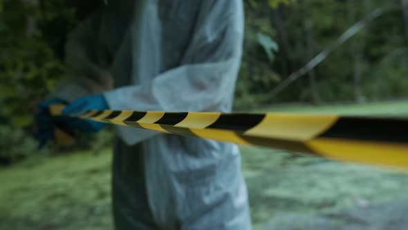 People Wearing Ppe White Suits Protecting Territory with Signal Tape