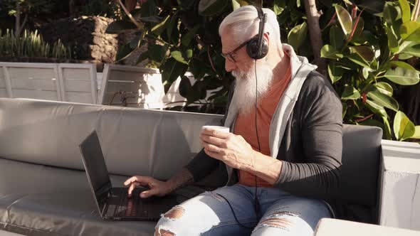 Senior Man Working with Laptop