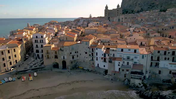 Cefalu Sicily Sunset at the Beach of Cefalu Sicilia Italy Mid Age Men and Woman on Vacation Sicily