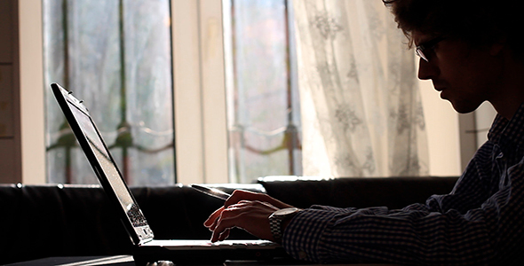 Man Working On Laptop