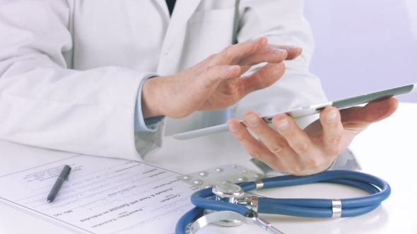 Doctor Using a Digital Tablet 