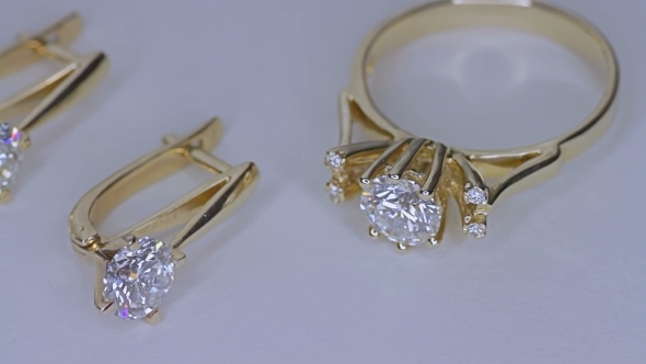 Golden Ring With a Diamond On White