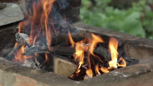 Burning Wood In a Brazier