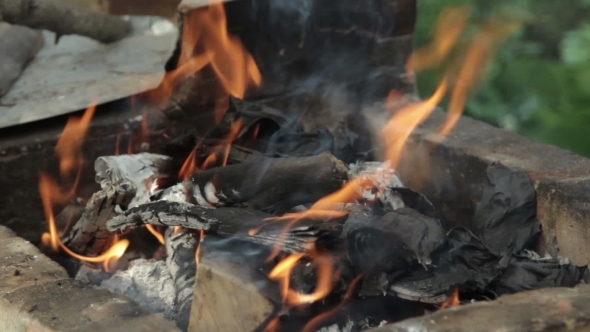 Burning Wood In a Brazier