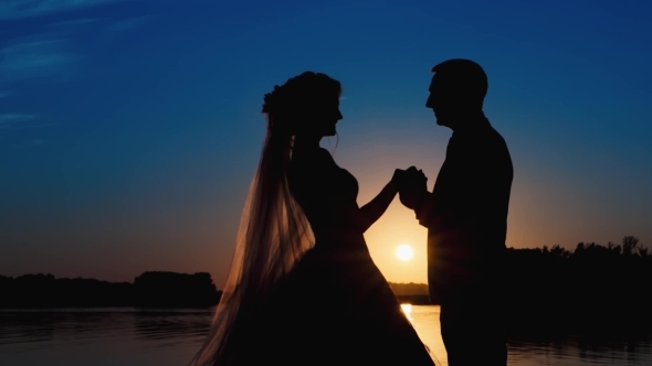 Silhouette Newlyweds At Sunset