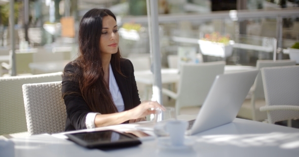 Businesswoman Working At An Open-air Table