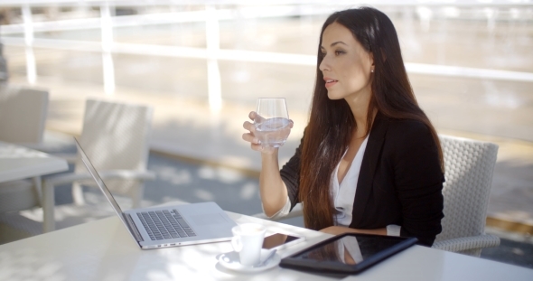 Businesswoman Enjoying Coffee At a Restaurant alt