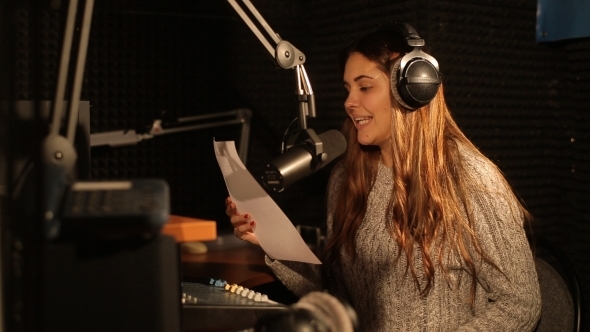 A Radio DJ Reads News In The Broadcasting Studio