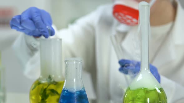 Female Researcher Taking Sample of Plant Extract for Studying, Cosmetology