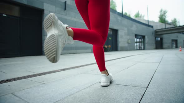 Female Legs Running on Urban Street. Closeup Woman Legs Running Outdoor