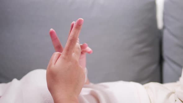 Close up of young woman hands using and holding smart phone, scrolling up and down on touchscreen, t