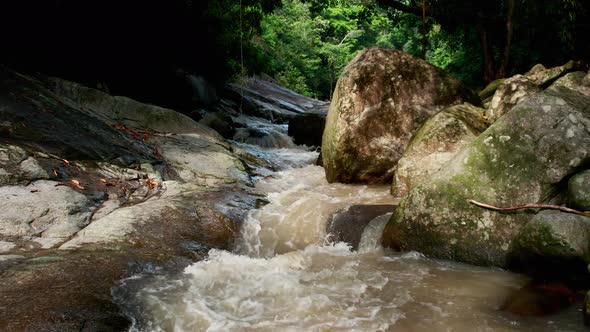 Hovering forward over brook close to Hin Lat waterfall, Koh Samui Thailand