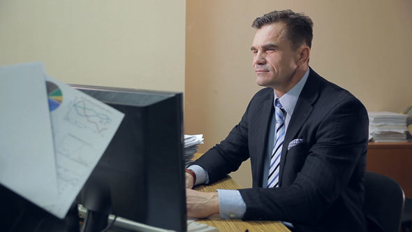 Office Worker in front of Desktop Computer