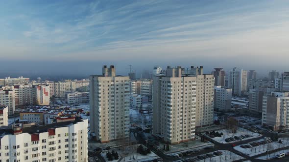 Flight over the city block. Modern multi-storey buildings.