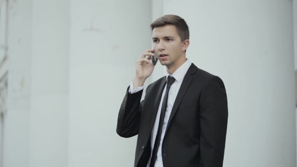 Young Businessman Talking On Cell