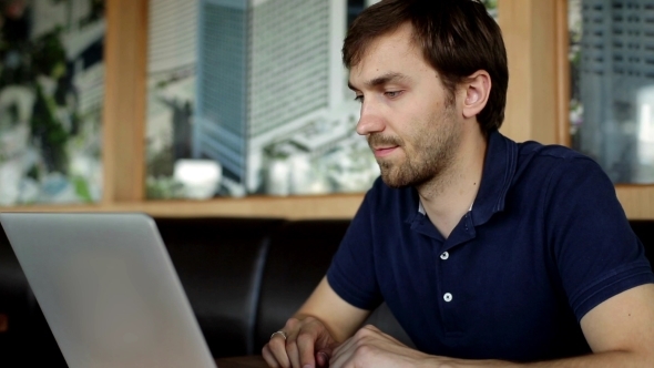 Young Man Looking In Laptop 