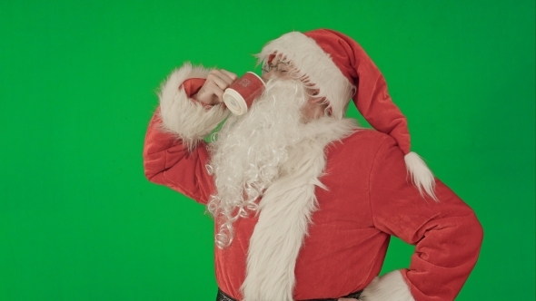 Santa Drinks From a Red Cup On a Green Screen