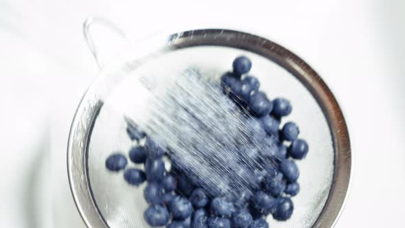 Tossing Blueberries Slow Motion Washing In Colander Under Sink Water