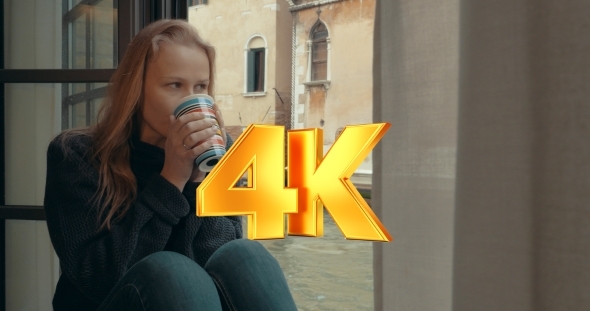 Wistful Woman Having Coffee At Home In Venice