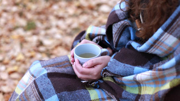 Woman Closed with a Blanket and Drinking Tea