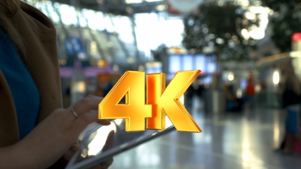 Woman Spending Time With Tablet PC At The Airport