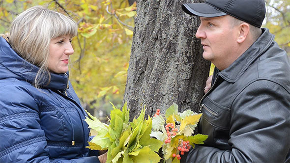 Woman and Man in Autumn Park