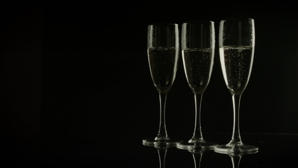 Three Glasses Of Champagne On Black Background