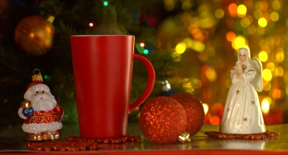 Red Cup With Christmas Toys Over Holiday