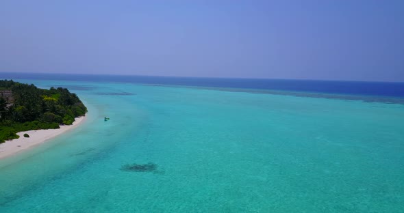 Tropical birds eye abstract shot of a summer white paradise sand beach and aqua blue ocean backgroun