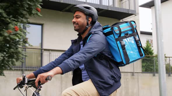 Indian Delivery Man with Bag Riding Bicycle