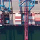 Drone Flying Over a Container Ship During Cargo Operations Over the Customs Area - VideoHive Item for Sale