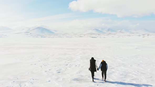Mother With Son Exploring White Winter Landscape