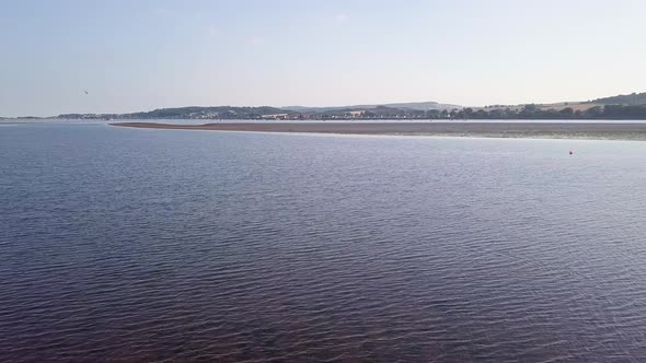 Lympstone estuary at high tide. United Kingdom. 4K Aerial footage.