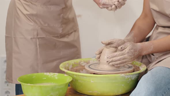 Romantic Couple in Love Working Together on Potter Wheel and Sculpting Clay Pot