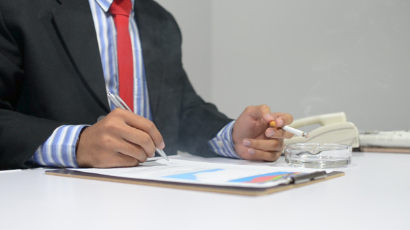 Smoking Businessman Working