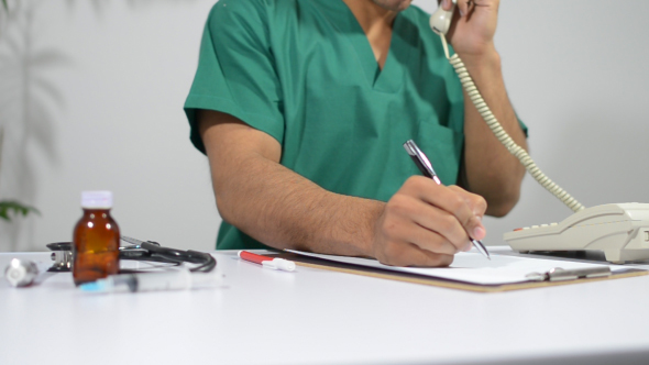 Doctor Talk on Telephone for Medical Document Work