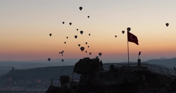 Aerial Cinematic Drone View of Colorful Hot Air Balloon Flying Over Cappadocia