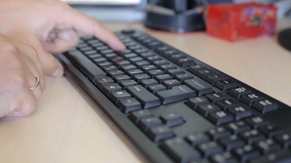 Man Typing On Computer Keyboard 