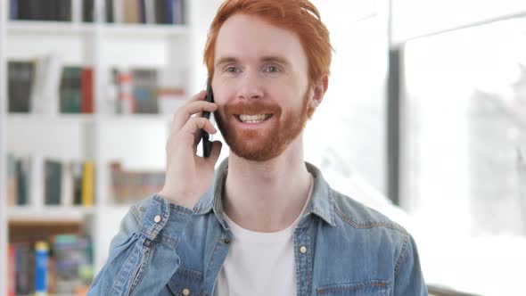 Casual Redhead Man Talking on Phone