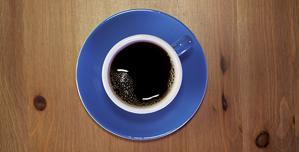 Pouring Serving Coffee In A Blue Cup