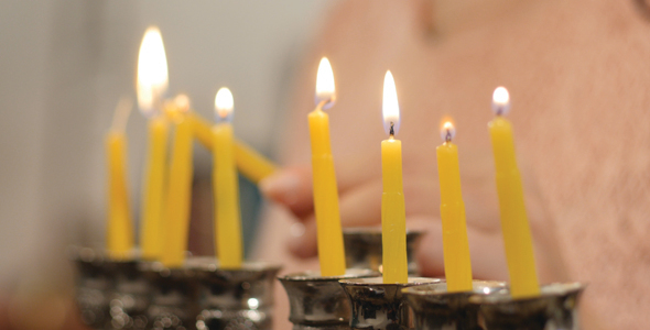 Lighting Yellow Hanukkah Candles