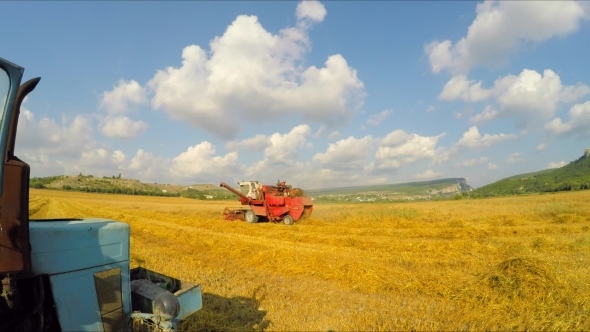 Combine Mowing Grains At Picturesque Lane