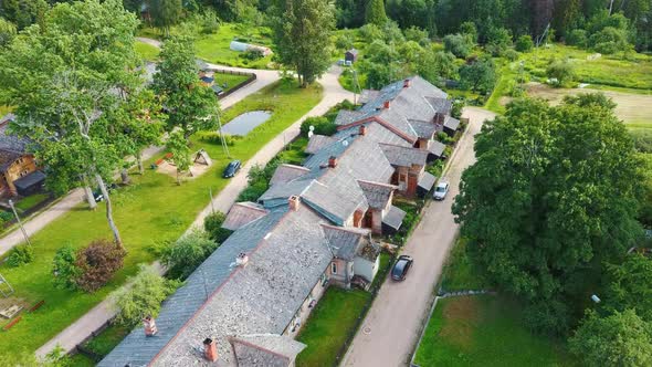 Old Wooden Houses Built for Paper Mill Workers in Ligatne. Wooden Row House 4K Aerial Shot	